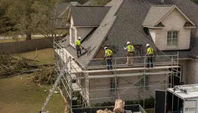 Storm damage restoration crew drying flooded Stockton, CA home after roof leak and water intrusion